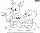 Baby Looney Tunes spelen in het zand. Baby Bugs Bunny, Baby Tweety en Baby Sylvester