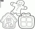 Drie kerstkoekjes: een geschenk, een huis en een gingerbread man